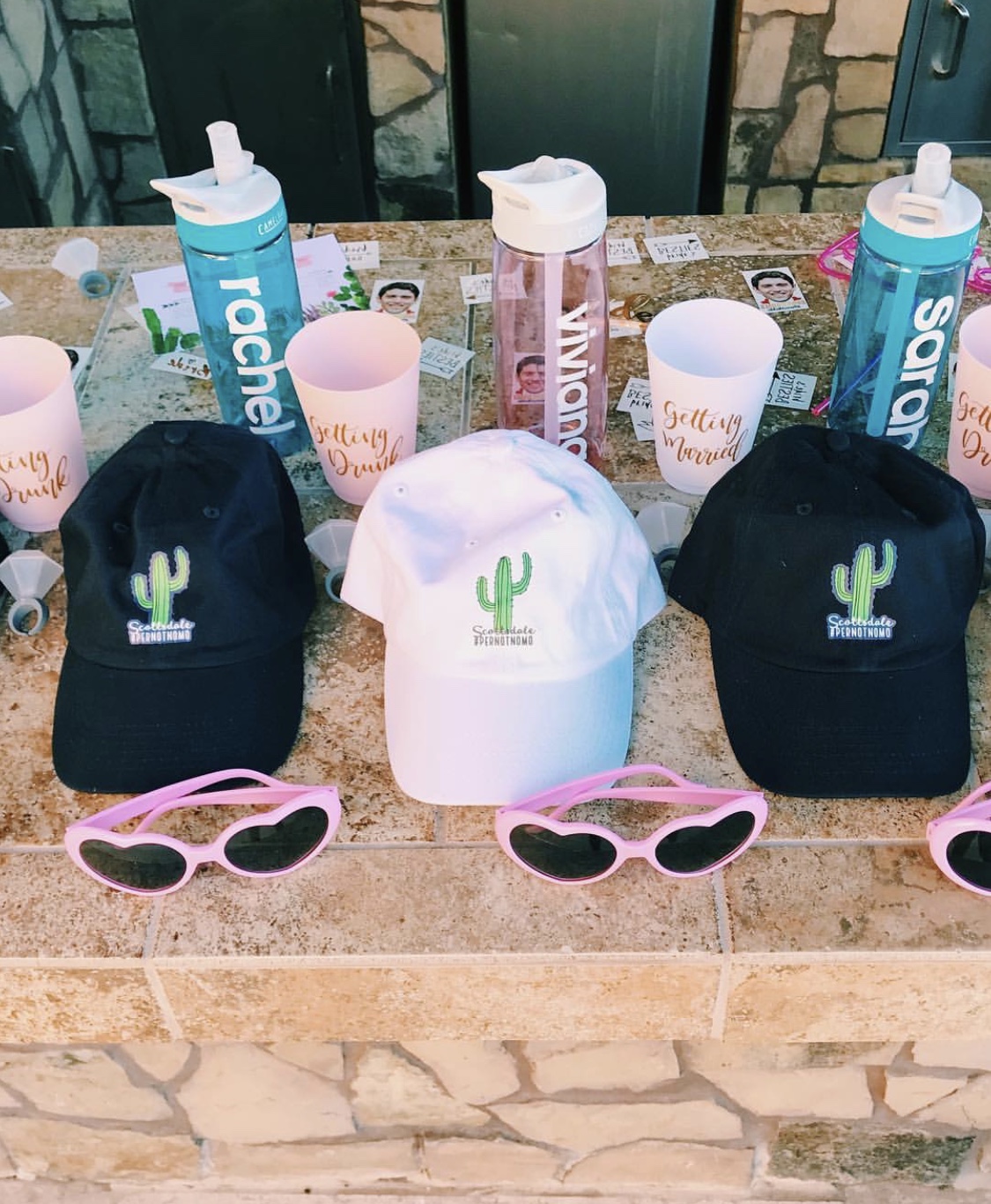 Photo of hats and glasses on a counter