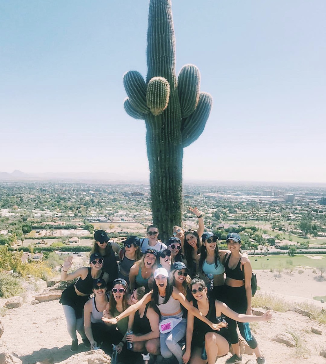 Photo of woman sitting together in desert after a workout