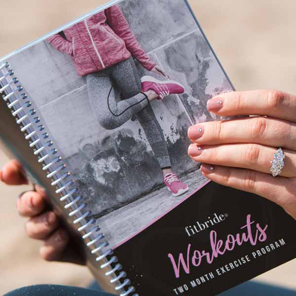 Bride holding the Fitbride Workout book