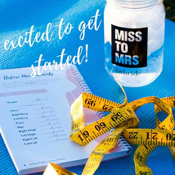 Fitbride book, mason jar and tape measure sitting on blue yoga mat